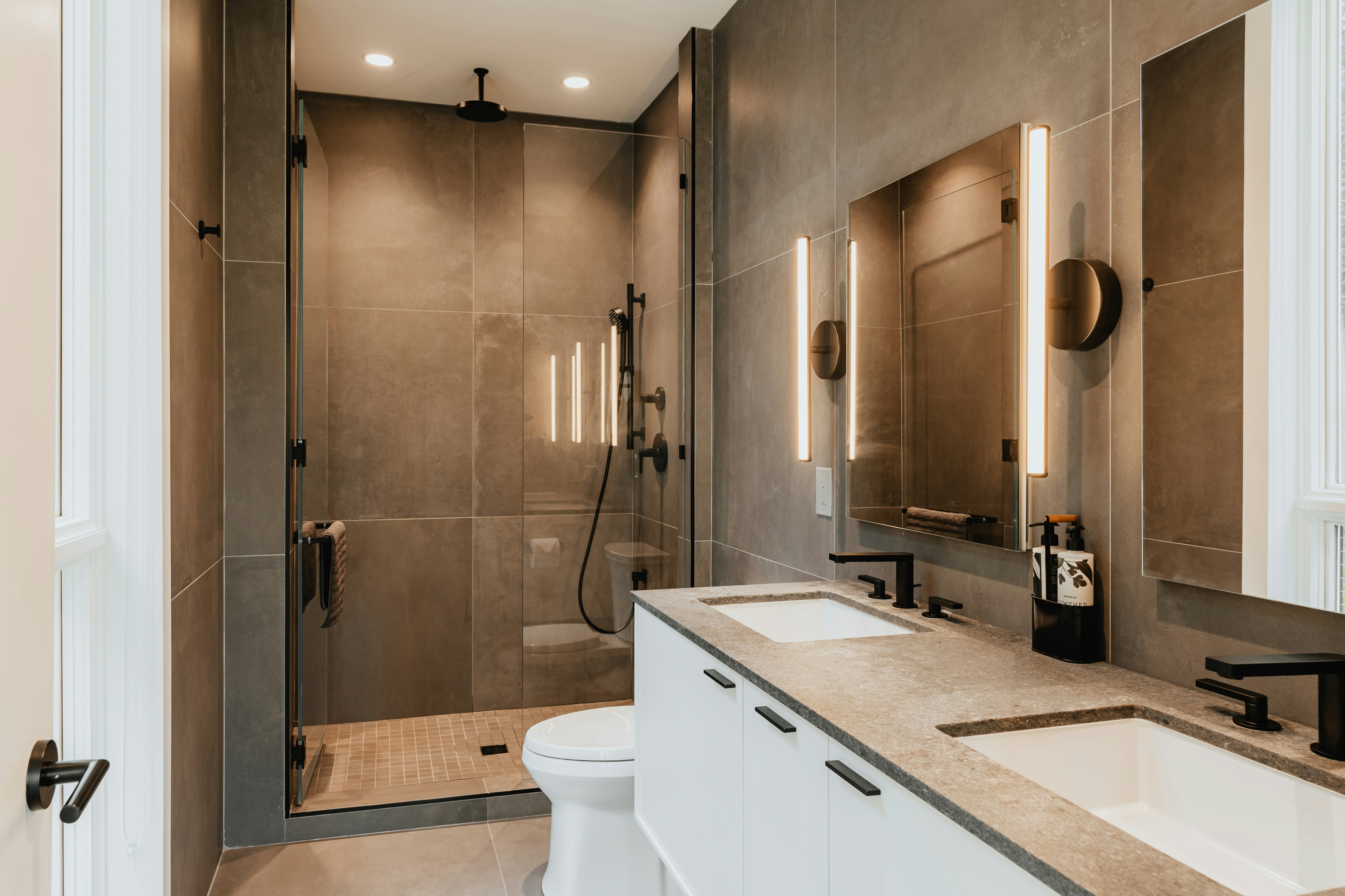 Luxury spa bathroom dark tile